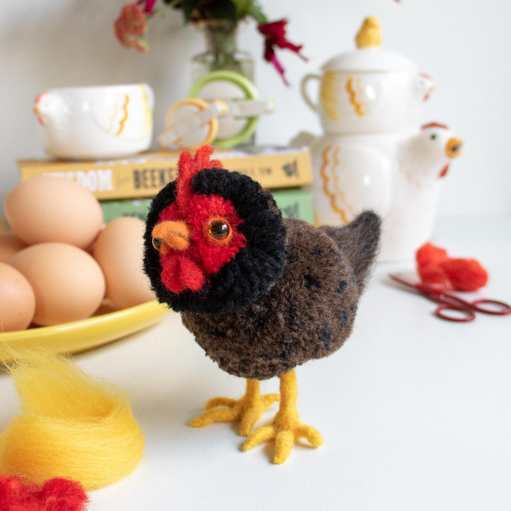 A Clover Felting Mat was used to create the needle felted elements of this Hen Pom Pom.